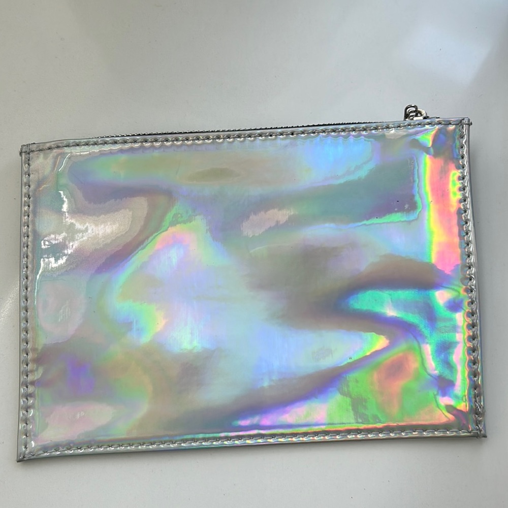 Iridescent cosmetic bag. New with tag. minor marks from store.  Very pretty!